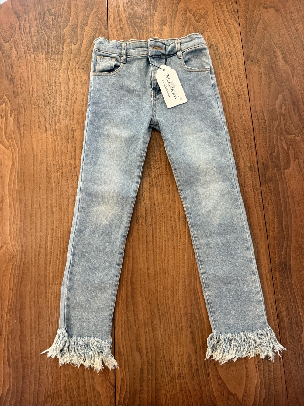 Light Wash Fringe Hem Women’s Jeans